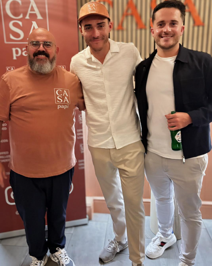 Scott, Charlie and Max, the founders of Casa Papi, together at the shop wearing Casa Papi branded T-shirts and cap